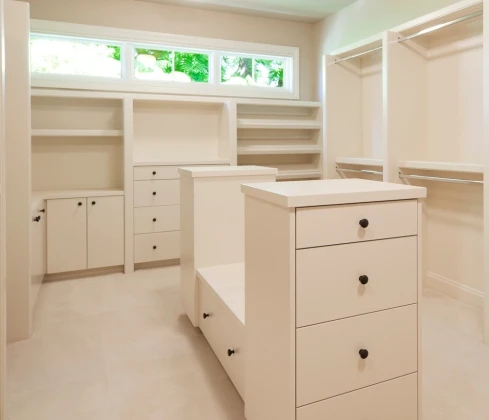 Custom walk in closet with organized shelving and hanging space